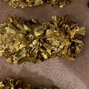 Gold cheerleading pom Poms